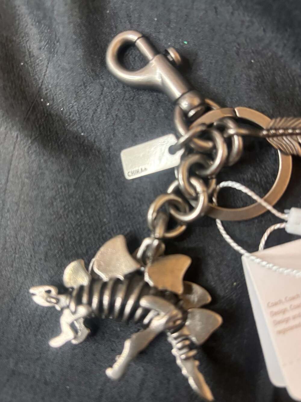 Coach Stegosaurus Skeleton Dinosaur Feather Key Chain Bag Charm